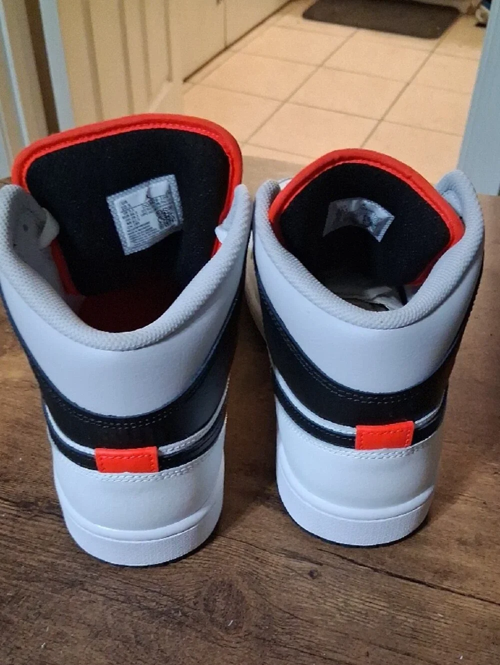 Jordan White Black and Orange Mid-Top Sneakers